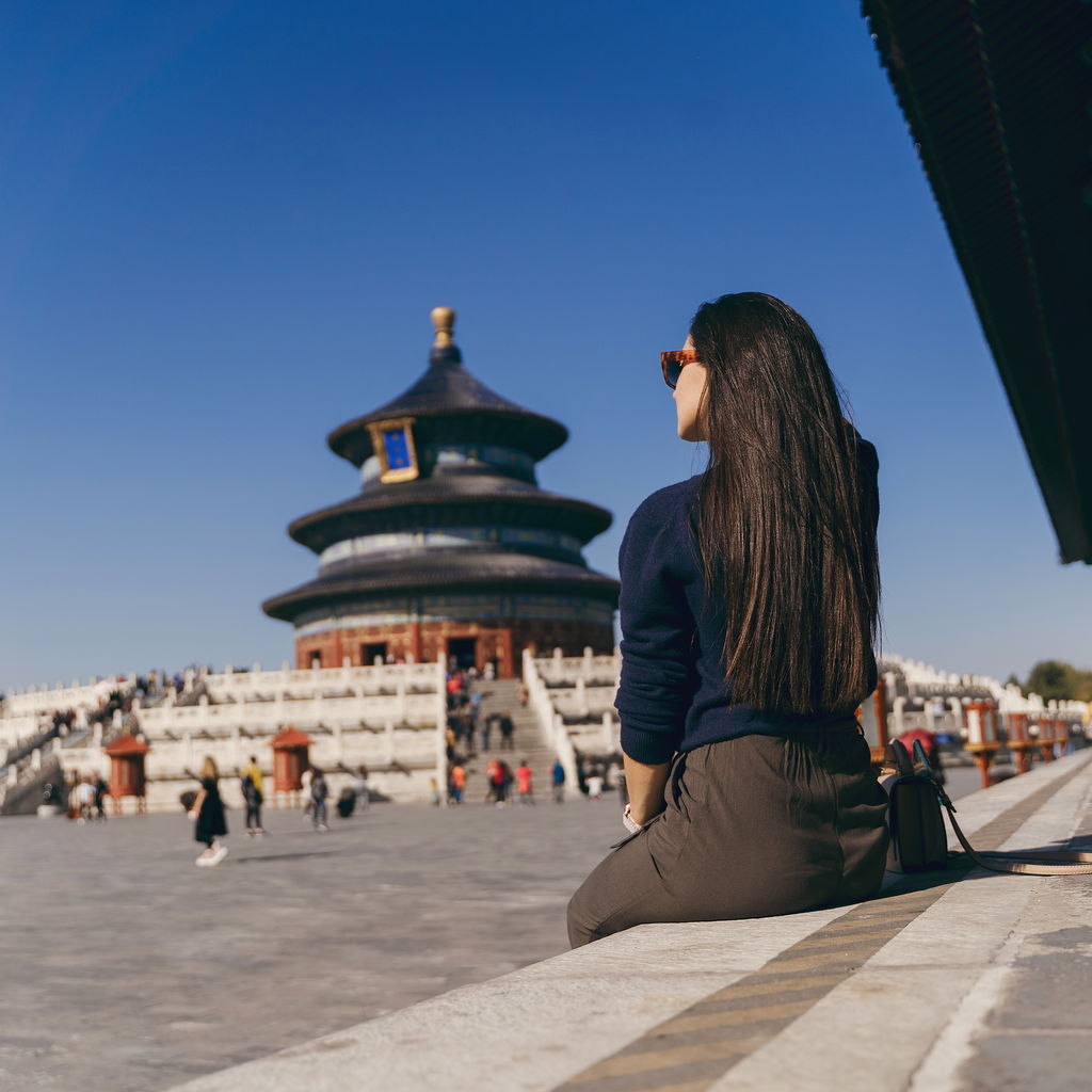 Woman sitting at a temple in China