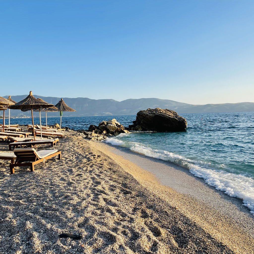 Beach with umbrellas chairs