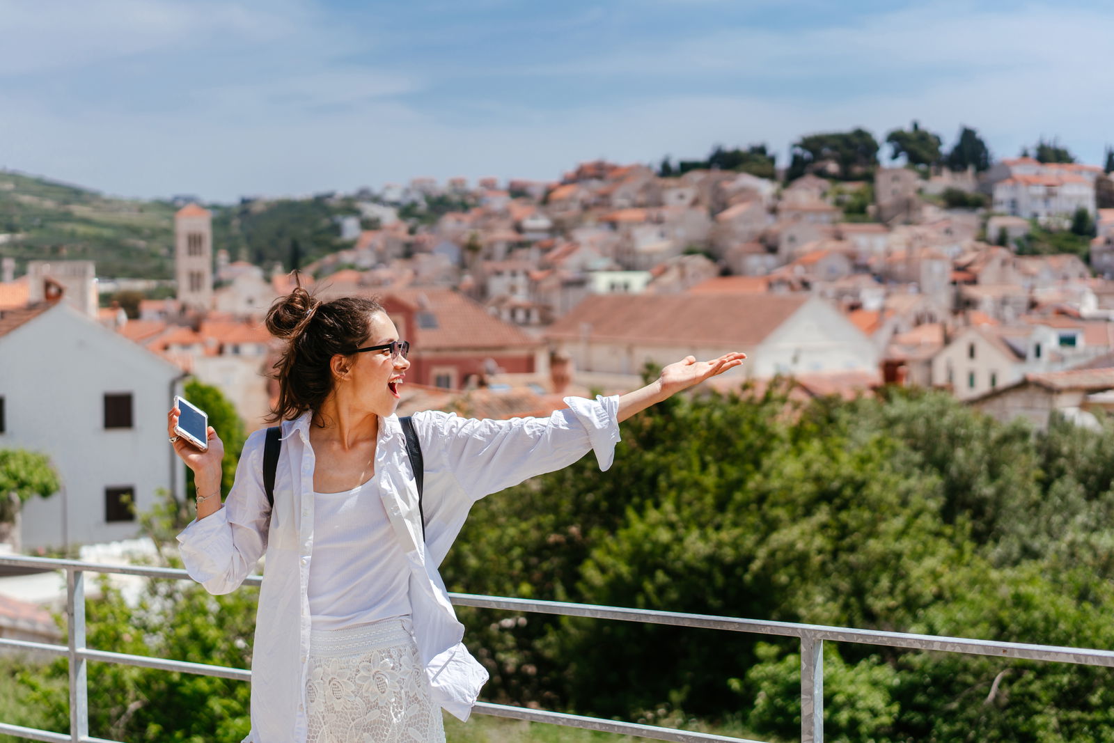 Young woman on balcony in Croatia