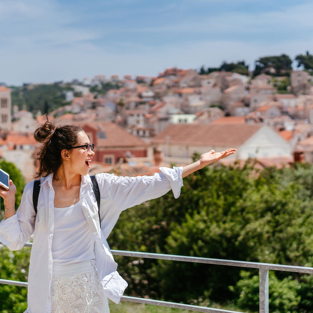 Young woman on balcony in Croatia