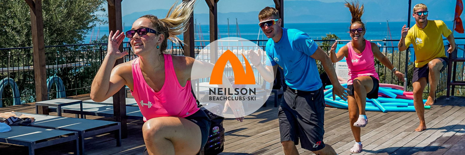 Fitness instructors at the pool of a beach resort