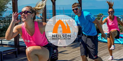Fitness instructors at the pool of a beach resort