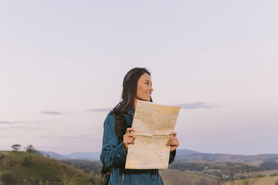 Woman with a world map