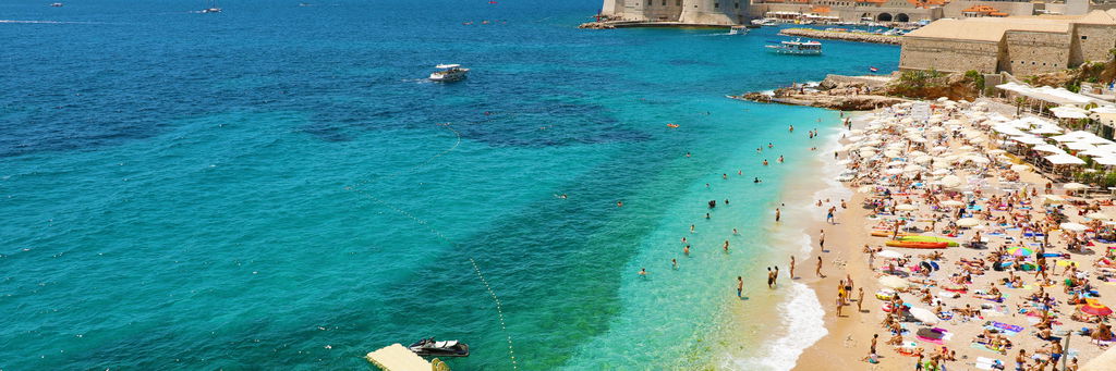 Idealistic view of Dubrovnik with beach and city on the background