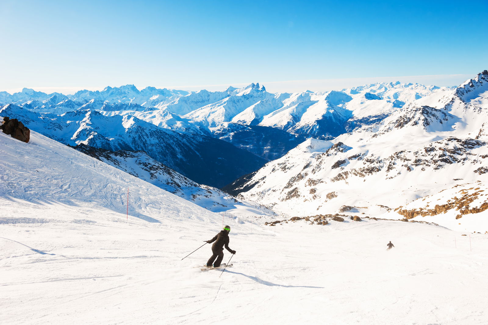 Skier rides down slop French Alps