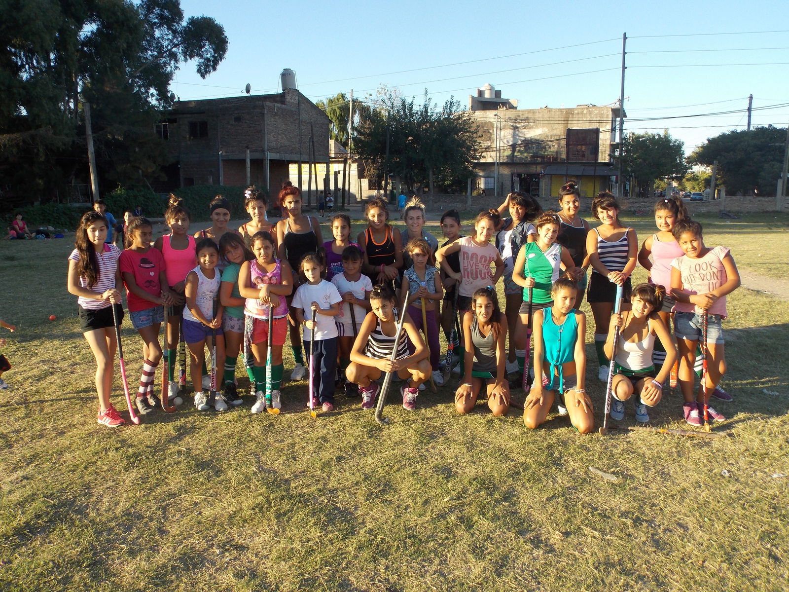 Children in Argentina on a hockey field