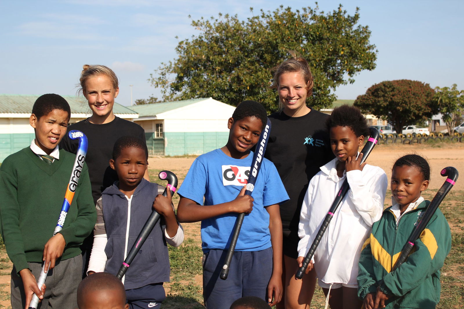 Two volunteers with children in Curacao