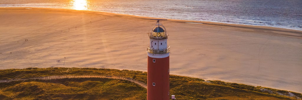 The Texel lighthouse at sunset on the Dutch island of Texel