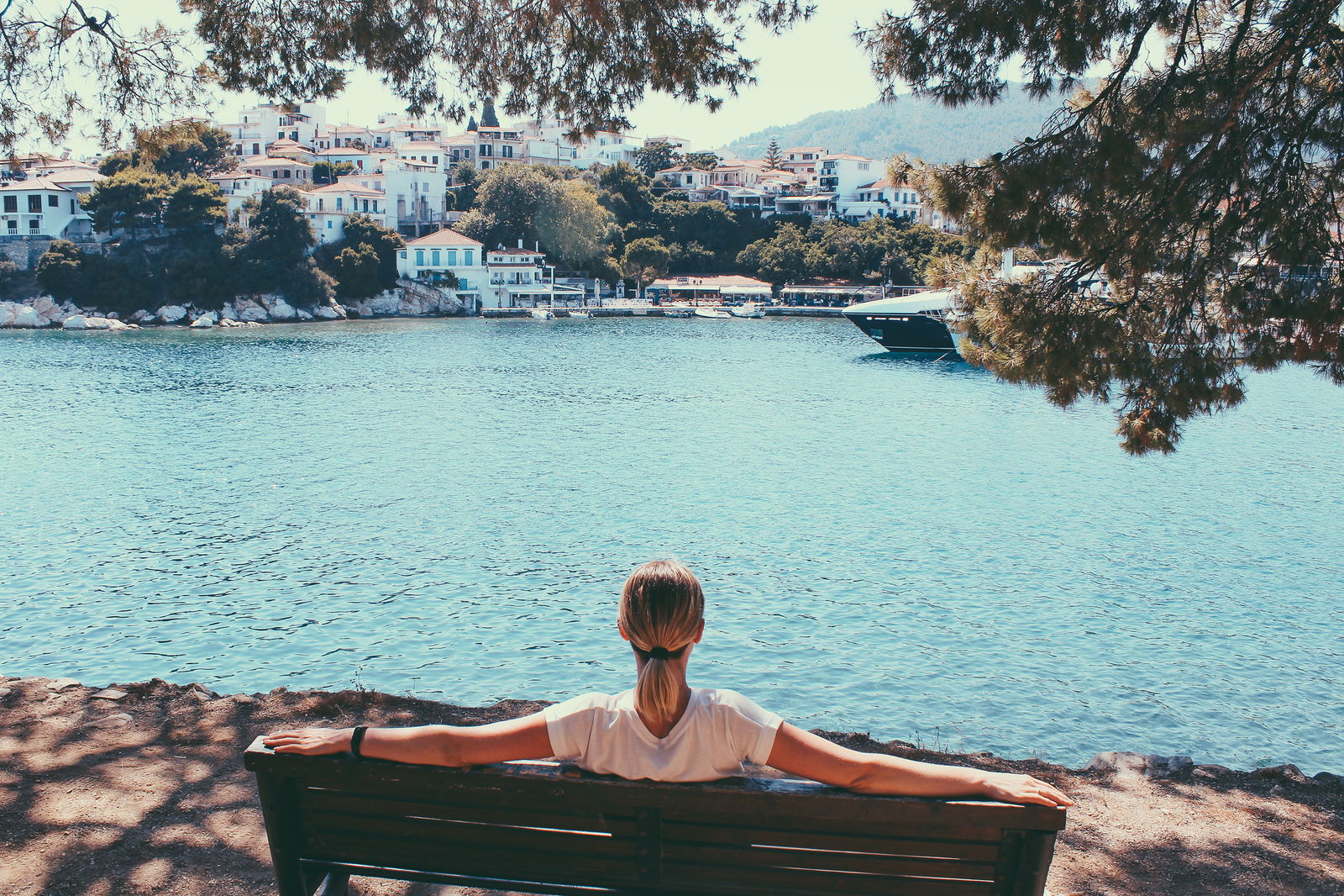 Female traveler admiring marine view greece