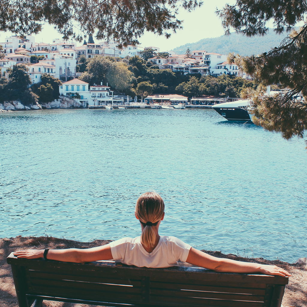 Female traveler admiring marine view greece